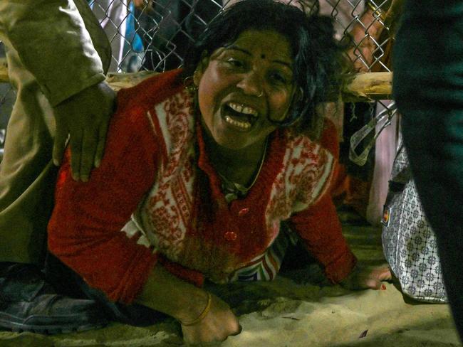 TOPSHOT - A devotee reacts at the site of a stampede amid the ongoing Maha Kumbh Mela festival in Prayagraj on January 29, 2025. (Photo by ARUN SANKAR / AFP)