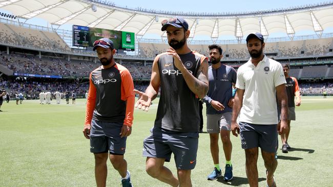 Virat Kohli leads his team off at Perth Stadium. Picture: AAP