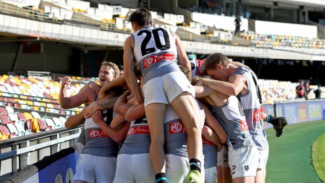 Port Adelaide players celebrate together after Robbie Gray’s winning goal against Carlton on Sunday. Picture: Bradley Kanaris/Getty Images