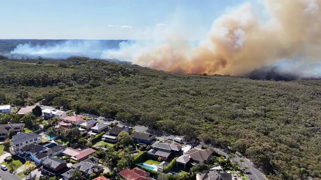 Firefighters battle out-of-control blaze, residents trapped