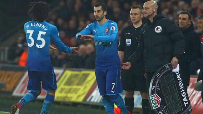 The English Premier League uses boards to announce substitutes and injury time.