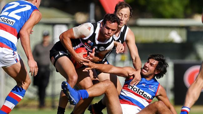 04/05/19 - SANFL: Port Adelaide v Central District at Alberton Oval.  Port's Steven Motlop takes on Central's Jonathan Marsh and Troy Menzel.Picture: Tom Huntley