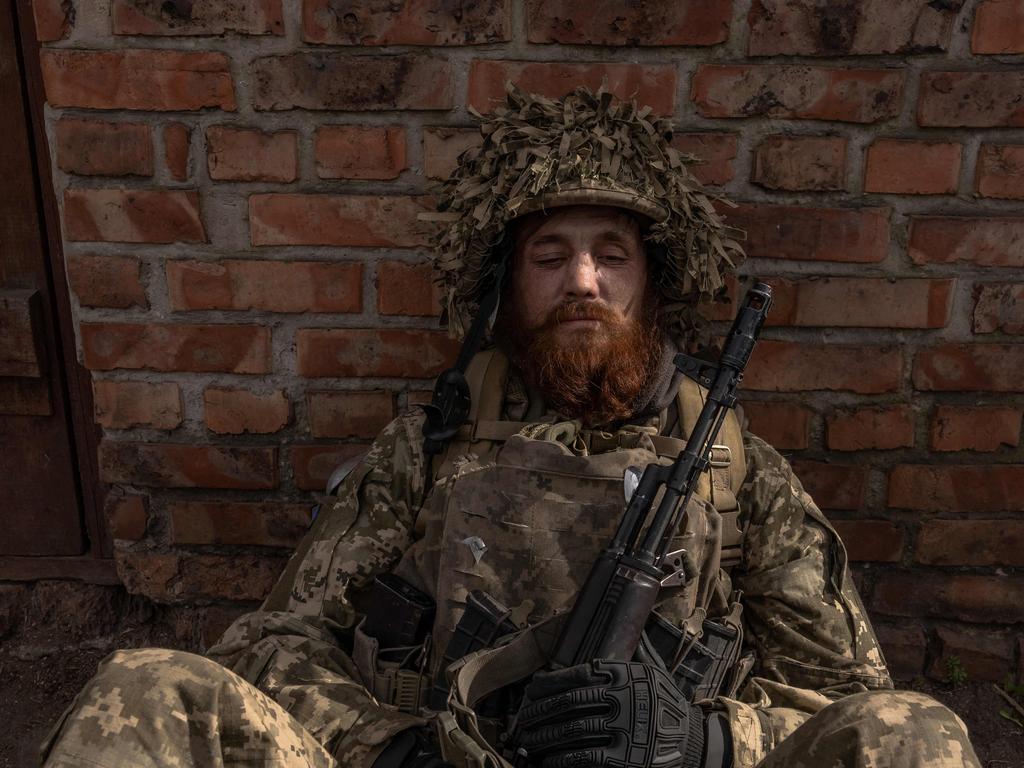 TOPSHOT - -- AFP PICTURES OF THE YEAR 2024 -- soldier of the 23rd Mechanized Brigade sits as he waits to deploy toward the frontline in the Avdiivka direction, in the Donetsk region, on April 3, 2024, amid the Russian invasion of Ukraine. Picture: AFP