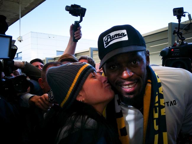 Fan Julie Wall stole a kiss with Usain Bolt after he arrived. Picture: Jack Morphet