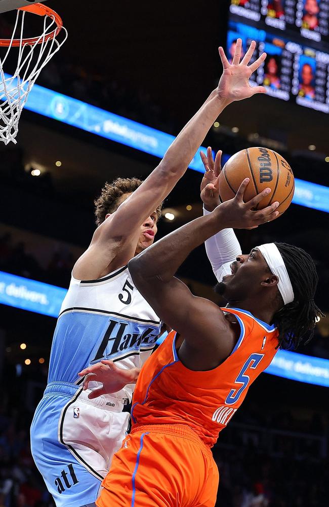 Luguentz Dort of the Oklahoma City Thunder is defended by Dyson Daniels of the Atlanta Hawks during the first quarter at State Farm Arena on February 28.