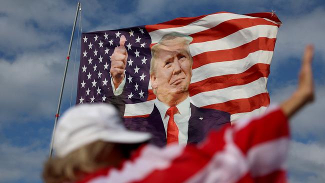 A flag featuring former President Donald Trump flies near his Mar-a-Lago home. Picture: Getty Images/AFP.