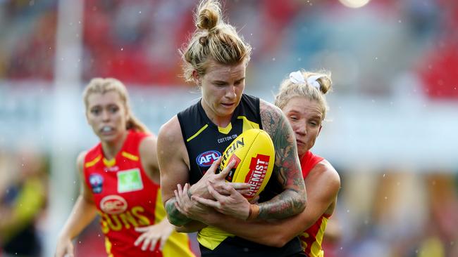 Phoebe Monahan of the Tigers is tackled by Paige Parker of the Suns during the round 2 AFLW match between the Gold Coast Suns and the Richmond Tigers at Metricon Stadium on February 15, 2020 in Gold Coast, Australia. (Photo by Chris Hyde/AFL Photos/Getty Images)