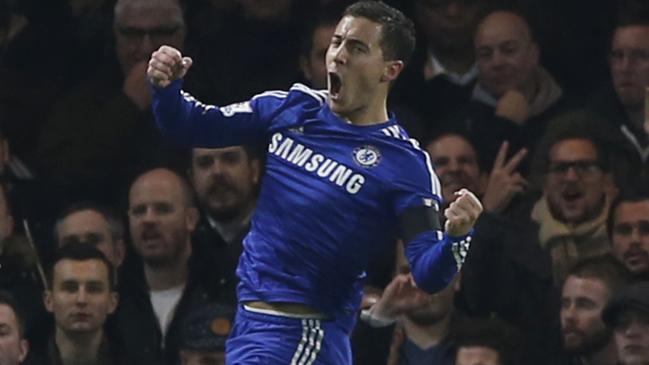 Chelsea's Eden Hazard, right, leaps and punches the air as he celebrates after scoring the opening goal of the game during the English Premier League soccer match between Chelsea and Tottenham Hotspur at Stamford Bridge stadium in London, Wednesday, Dec. 3, 2014. (AP Photo/Alastair Grant)