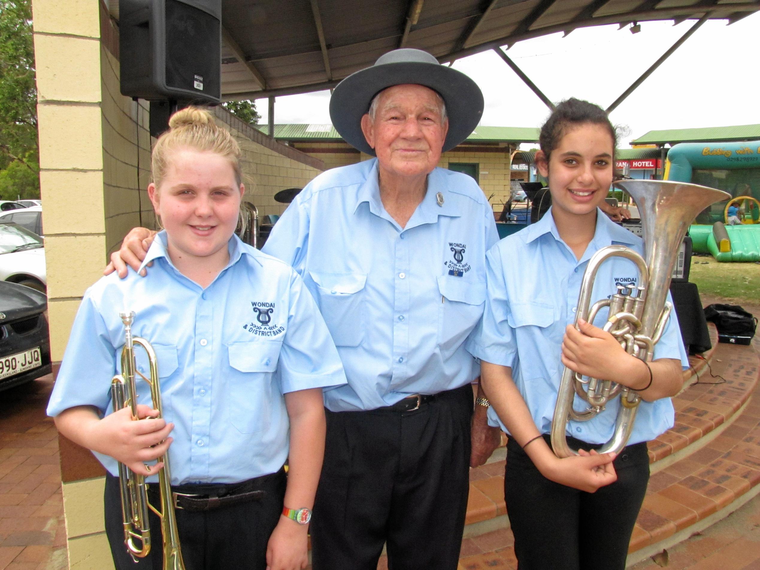 LOVERS OF MUSIC: Percy Iszlaub (centre) with some of the band's younger members Philippa Hunt, 11 and Adelaide Hockenhull, 13. Photo: Katrina Scott / South Burnett Times. Picture: Katrina Scott