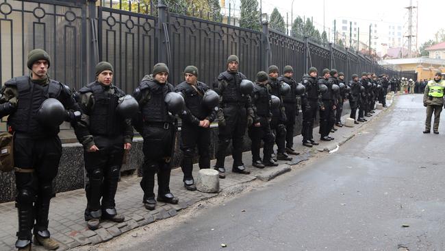 Policemen guard against protesters at the Russian consulate in Odesa. Picture: AFP.