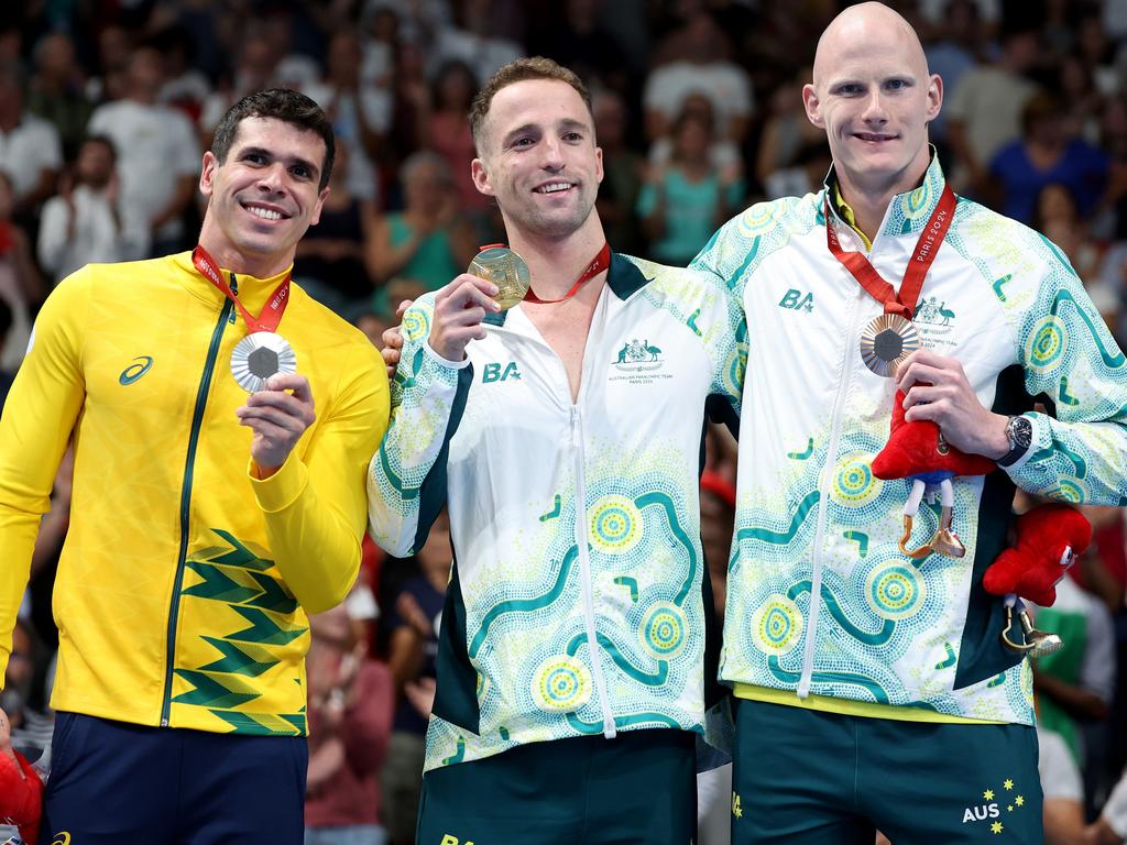 Silver medallist Phelipe Andrews Melo Rodrigues of Team Brazil, gold medallist Thomas Gallagher and bronze medallist Rowan Crothers of Team Australia during the medal ceremony of the men's 50m freestyle S10 at Paris La Defense Arena on August 29. Picture: Michael Reaves/Getty Images