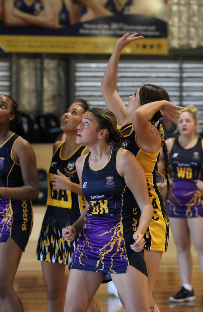 Netball action at QISSN 2024 held in Townsville. St Thomas More College v St Joseph's College