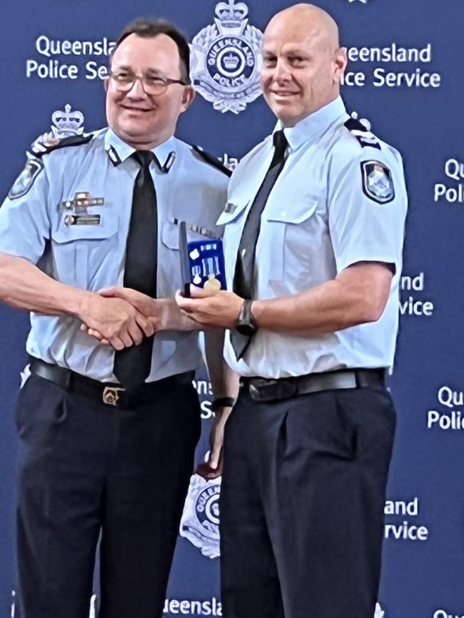 Senior Constable Paul Davies with Assistant Commissioner Brian Connors.