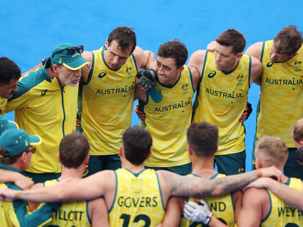 PARIS, FRANCE - JULY 27: Team Australia huddle following victory in the Men's Pool B match between Australia and Argentina on day one of the Olympic Games Paris 2024 at Stade Yves Du Manoir on July 27, 2024 in Paris, France. (Photo by Alex Pantling/Getty Images)