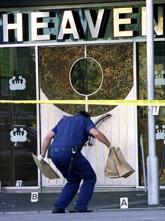 SA police officer collecting evidence at scene of drive-by shooting outside Heaven nightclub on North Terrace, Adelaide, in 2003.