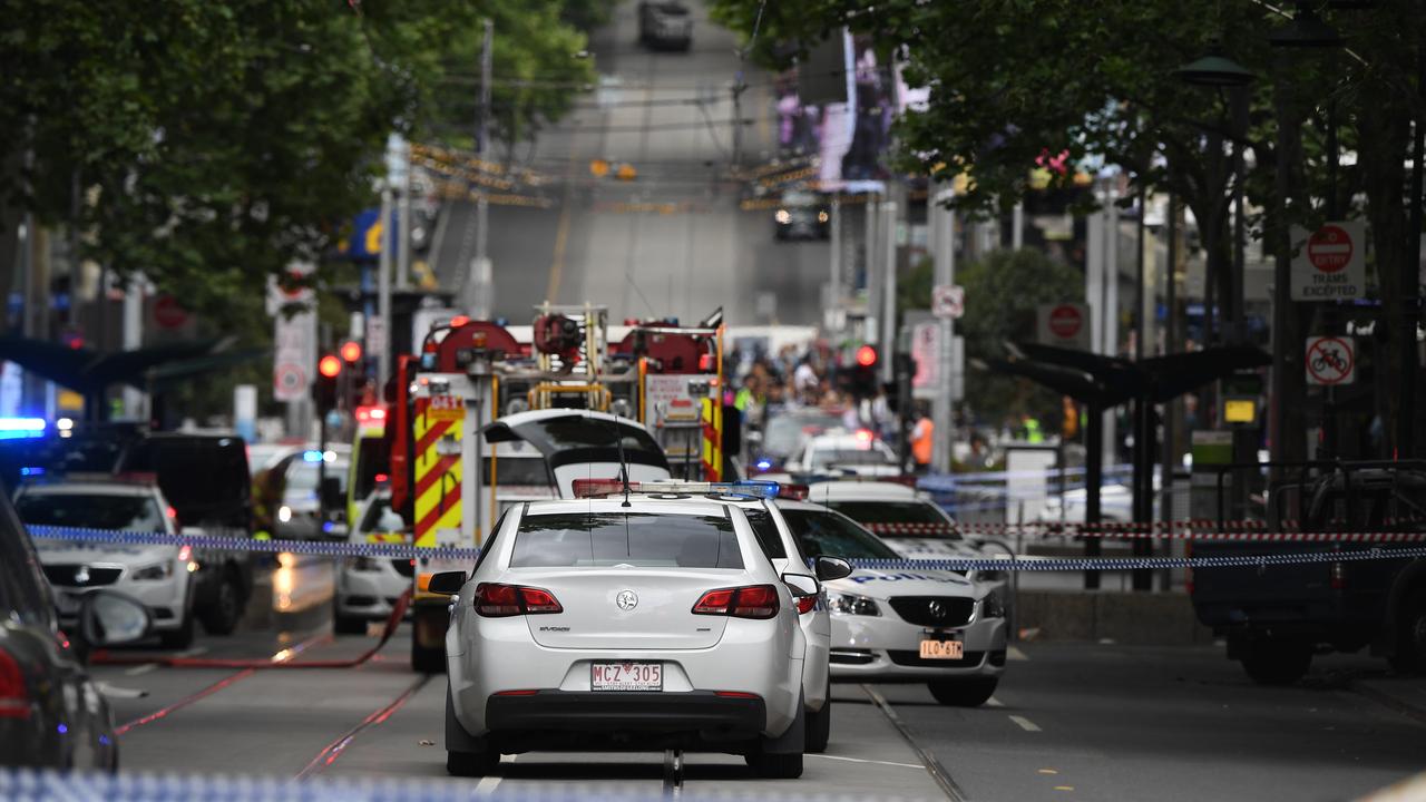 Police on Bourke Street, Saturday morning.