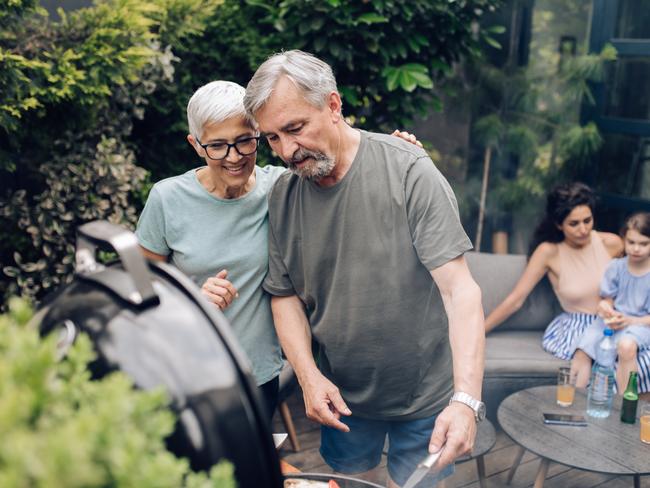 SENIOR/PENSIONER/MATURE/ELDERLY/OVER 65/GRANDPARENT/RETIREE/SUPERANNUATION. Picture: istock Senior couple preparing barbecue for the whole family at the backyard.