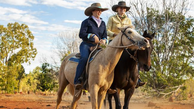 Kate Everett and daughter Meg work their horses on the family property outside Katherine in the Northern Territory in 2020. Photo: Lachie Millard