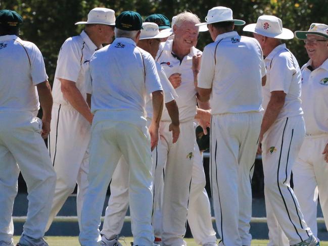 Aussie team congratulate bowler Ron Kasputtis after a wicket.Over 70s cricket: Australia v England. Picture: Peter Ristevski