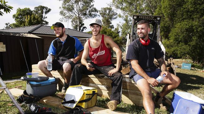 Young builders Shea Davies, Tyson Fitzgerald, and Mark Cornelio on a job sight. Picture: Justin Lloyd