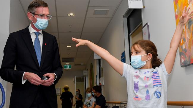 Schoolgirl Ines Panagopailos, 8, shows Premier Dominic Perrottet her ballet skills as she waits for her Covid vaccination at the Sydney Children’s Hospital in Randwick this week. Picture: AAP Image/Bianca De Marchi