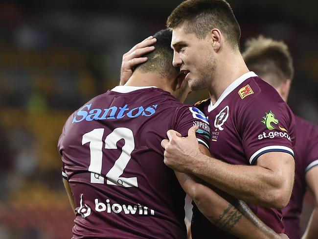 BRISBANE, AUSTRALIA - MARCH 20: Hunter Paisami of the Reds is congratulated by team mate James O'Connor after scoring a try during the round five Super RugbyAU match between the Queensland Reds and the Western Force at Suncorp Stadium, on March 20, 2021, in Brisbane, Australia. (Photo by Albert Perez/Getty Images)