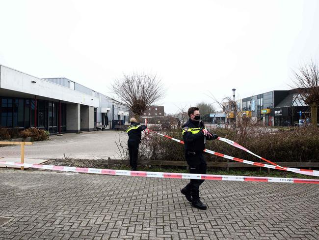 Dutch police officers at a testing centre in Bovenkarspel, northern Netherlands, following an explosion in an area close to where a testing centre was burnt down last January. Picture: AFP