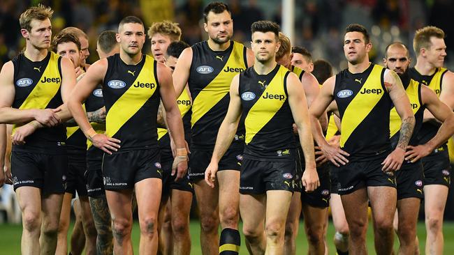 Richmond players walk off after the preliminary final loss.