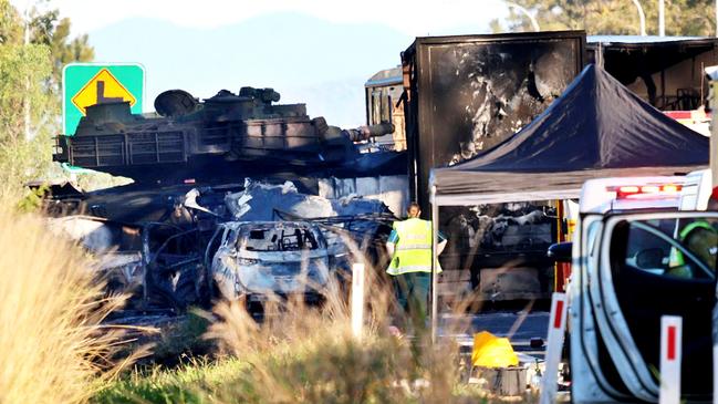 Scenes from the Bruce Highway crash at Bajool with the Army tank in the background. Photo - Steve Vit