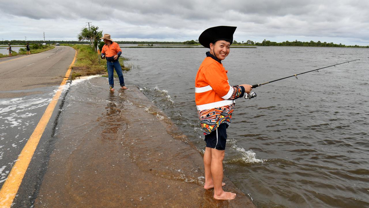 Peter Gravener and Truong Dang fish from Townsville’s Cape Cleveland Rd on Sunday. Picture: Evan Morgan