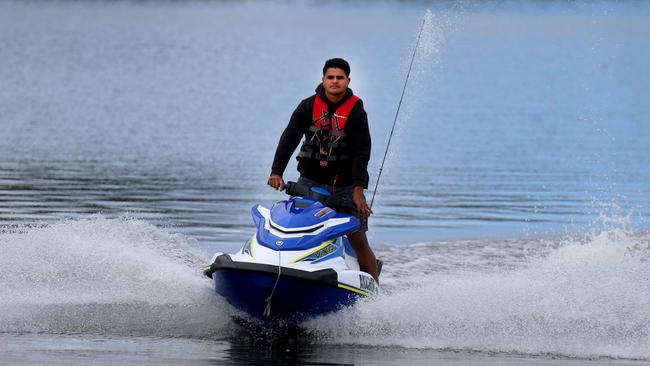 Latrell Mitchell arrives back from fishing from his jet ski on the Manning River at Taree. Photo: Peter Lorimer