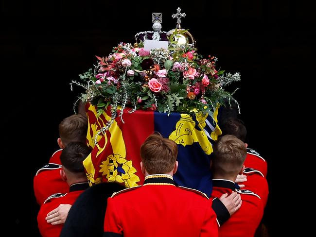 Pall bearers carry the coffin of Queen Elizabeth II with the Imperial State Crown resting on top into St. George's Chapel on September 19, in Windsor, England. Picture: Jeff J Mitchell/Getty Images