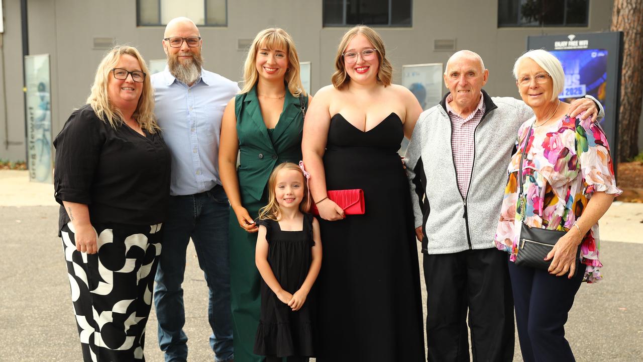 Graduate Peytyn McIntosh, centre, with parents Devon and Chrissy, sisters Parka, 6, and Prezley and grandparents David and Lesley at the Belmont High School year 12 graduation at GMHBA Stadium. Picture: Alison Wynd