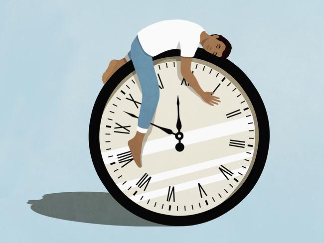 Man sleeping on top of clock. Picture: Getty Images