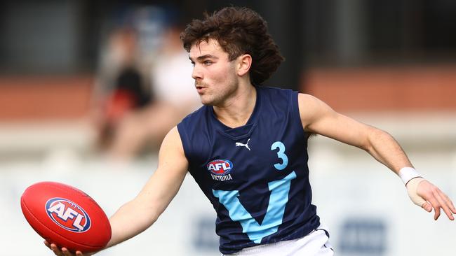 Nick Watson looks up to Melbourne small forward Kysaiah Pickett. Picture: Getty Images