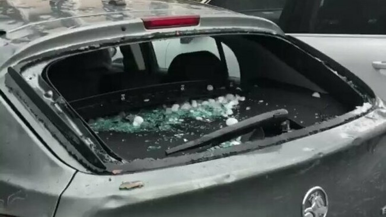 Car windows smashed by golf ball-sized hail in Canberra