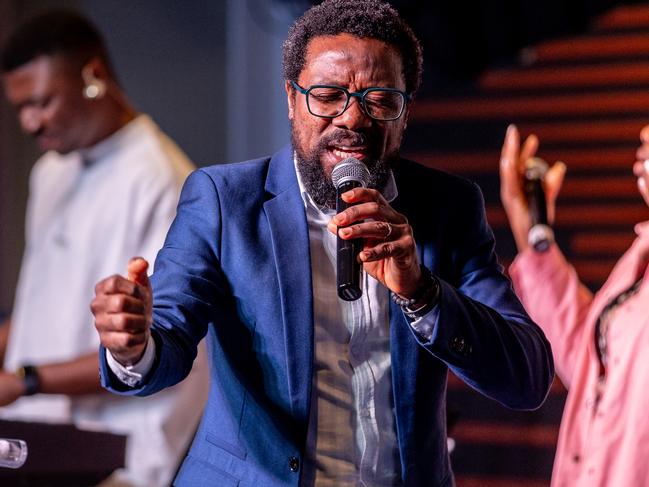 Pastor Joseph Wisdom Sesay leads the Healing and deliverance service at the Cross Purpose Church in Cranbourne. Picture: Jake Nowakowski