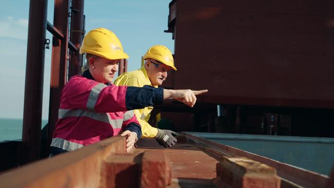 Workers oversee the first shipment of Core Lithium’s spodumene concentrate being loaded at Darwin Port on Thursday.