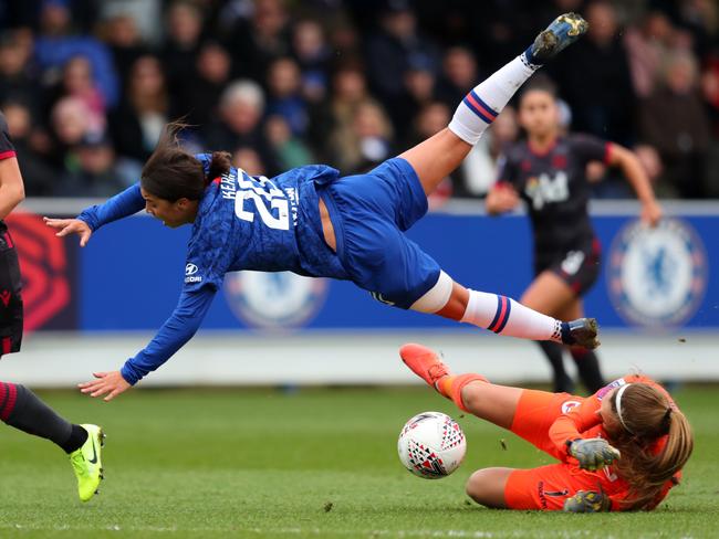KINGSTON UPON THAMES, ENGLAND - JANUARY 05: Sam Kerr of Chelsea is fouled by goalkeeper Grace Moloney of Reading during the Barclays FA Women's Super League match between Chelsea and Reading at Kingsmeadow on January 05, 2020 in Kingston upon Thames, United Kingdom. (Photo by Catherine Ivill/Getty Images)