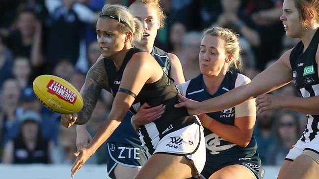 Moana Hope is tackled by Lauren Arnell. Picture: Wayne Ludbey