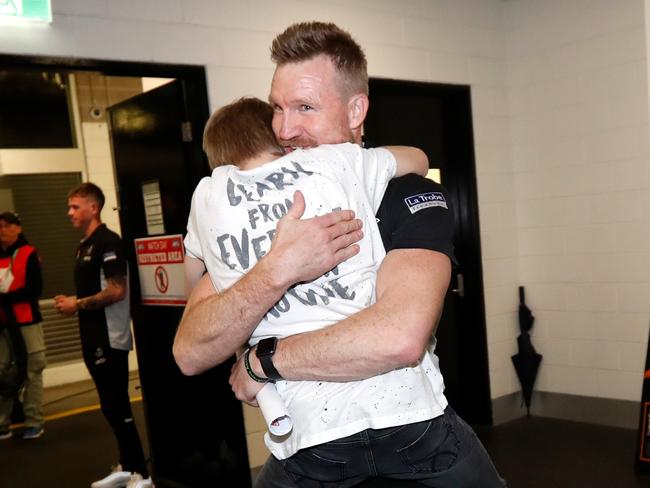 MELBOURNE, AUSTRALIA - SEPTEMBER 21: Nathan Buckley, Senior Coach of the Magpies and son Jett celebrate during the 2018 AFL First Preliminary Final match between the Richmond Tigers and the Collingwood Magpies at the Melbourne Cricket Ground on September 21, 2018 in Melbourne, Australia. (Photo by Michael Willson/AFL Media)