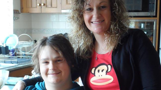 Julie Lawrence with her son Robbie, who suffered numerous mental health disorders but was still able to buy a gun.