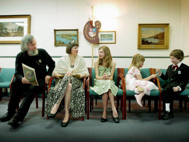 Paul Delprat, far left in civilian clothes, waits in the familiar territory of Mosman Council chambers in 2004. Picture: Daniel Griffiths.