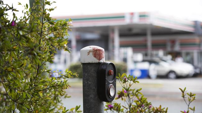 Blood could be seen on a pedestrian crossing post near the 7-11. (News Corp/Attila Csaszar)