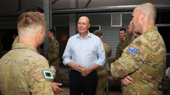 Minister for Defence Peter Dutton speaks with military personnel at Lavarack Barracks in Townsville. Picture: Max Bree