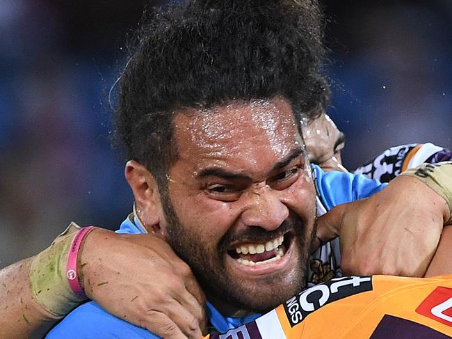 Konrad Hurrell of the Titans is tackled by Kodi Nikorima of the Broncos during the Round 17 NRL match between the Gold Coast Titans and the Brisbane Broncos at Cbus Super Stadium in Robina on the Gold Coast. Sunday, July 8, 2018. (AAP Image/Dave Hunt) NO ARCHIVING, EDITORIAL USE ONLY