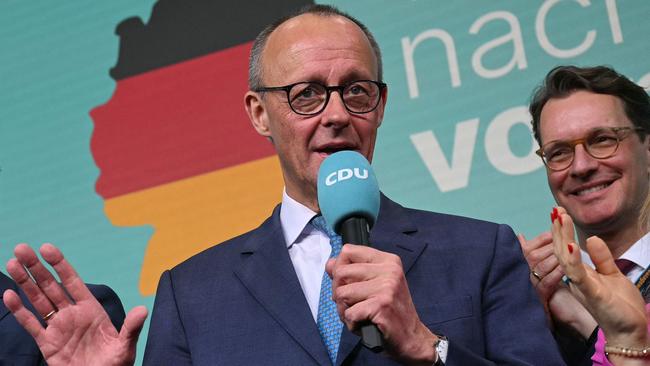 Friedrich Merz, leader of Germany's conservative Christian Democratic Union (CDU) and his party's candidate for Chancellor addresses supporters after the first exit polls in the German general elections were announced on TV during the electoral evening in Berlin on February 23, 2025. (Photo by INA FASSBENDER / AFP)