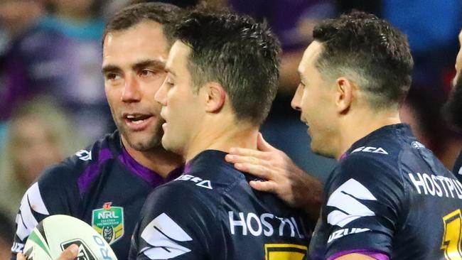 MELBOURNE, AUSTRALIA — SEPTEMBER 02: Cooper Cronk of the Storm is congratulated by Cameron Smith and Billy Slater after scoring a try which was later disallowed by the video referee for being off-side during the round 26 NRL match between the Melbourne Storm and the Canberra Raiders at AAMI Park on September 2, 2017 in Melbourne, Australia. (Photo by Scott Barbour/Getty Images)