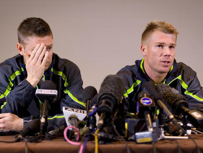 David Warner (right) and Michael Clarke face the media after Warner punched Root.