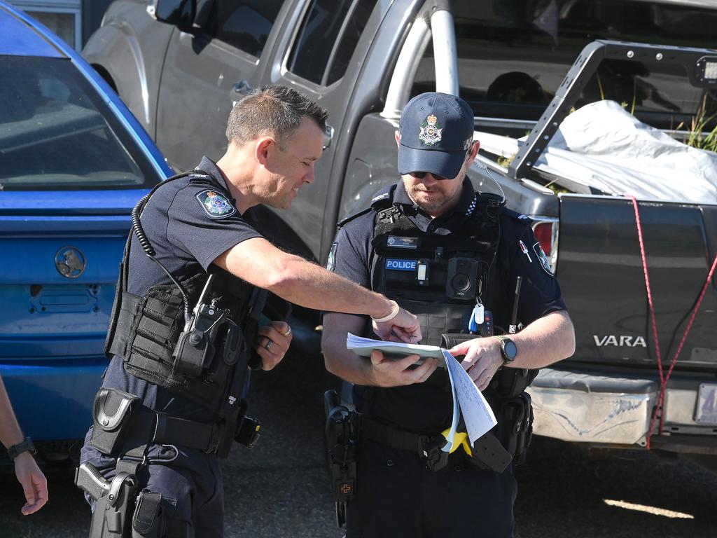 Police at the Bellmere address. Picture, John Gass